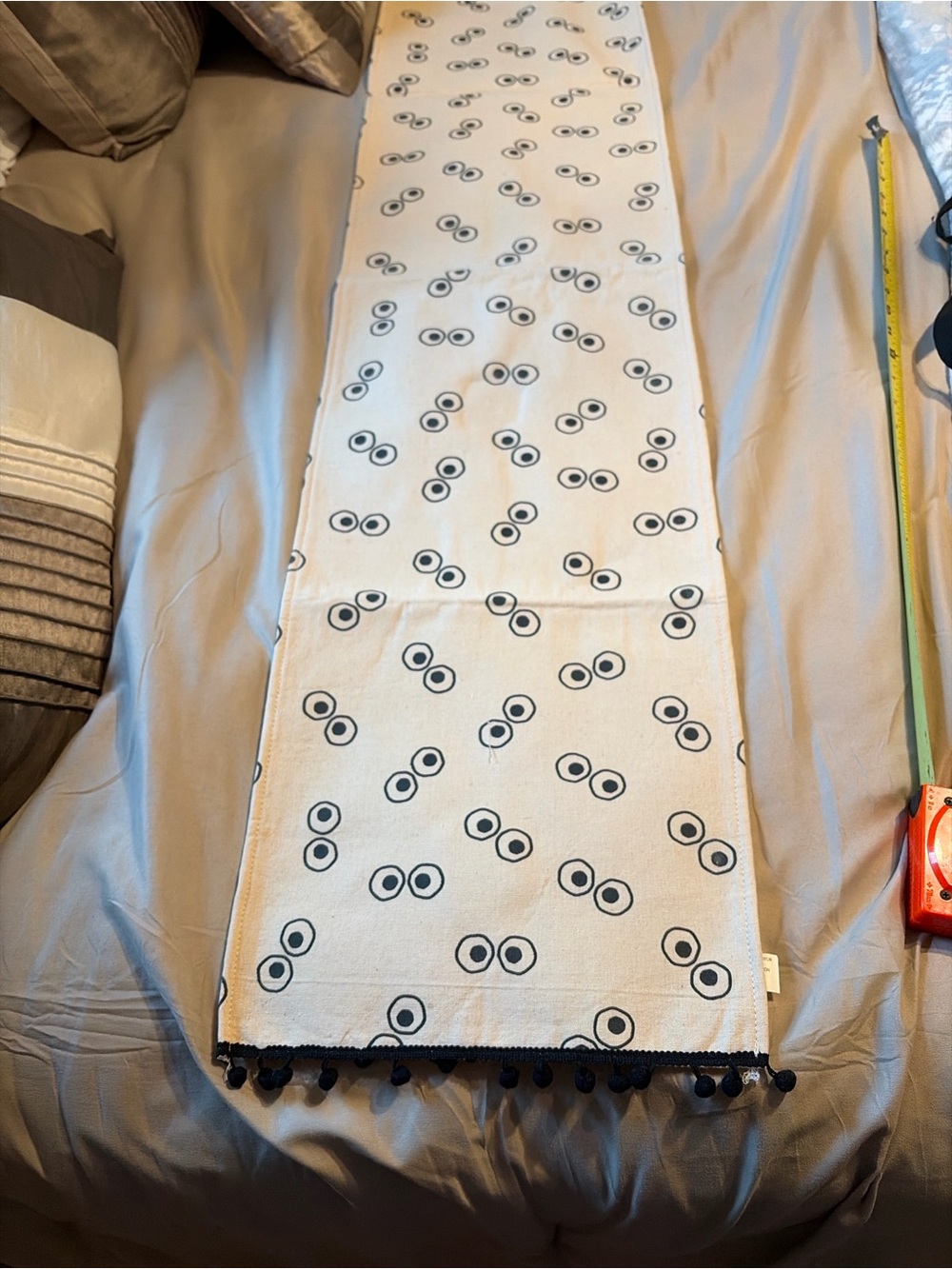 Neutral halloween eye ball Pattern Table Runner with Black Pom Trim